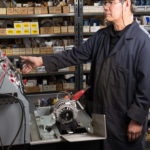 Employee working on alternator - Alternator repair in Longview, WA & Portland, OR - United Battery