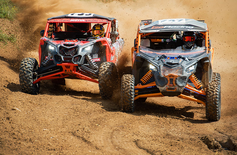 an image of two ATV drivers racing