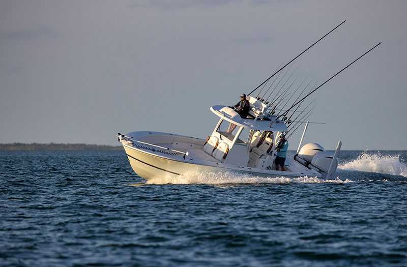 an image of a small boat taking a sharp turn on the sea