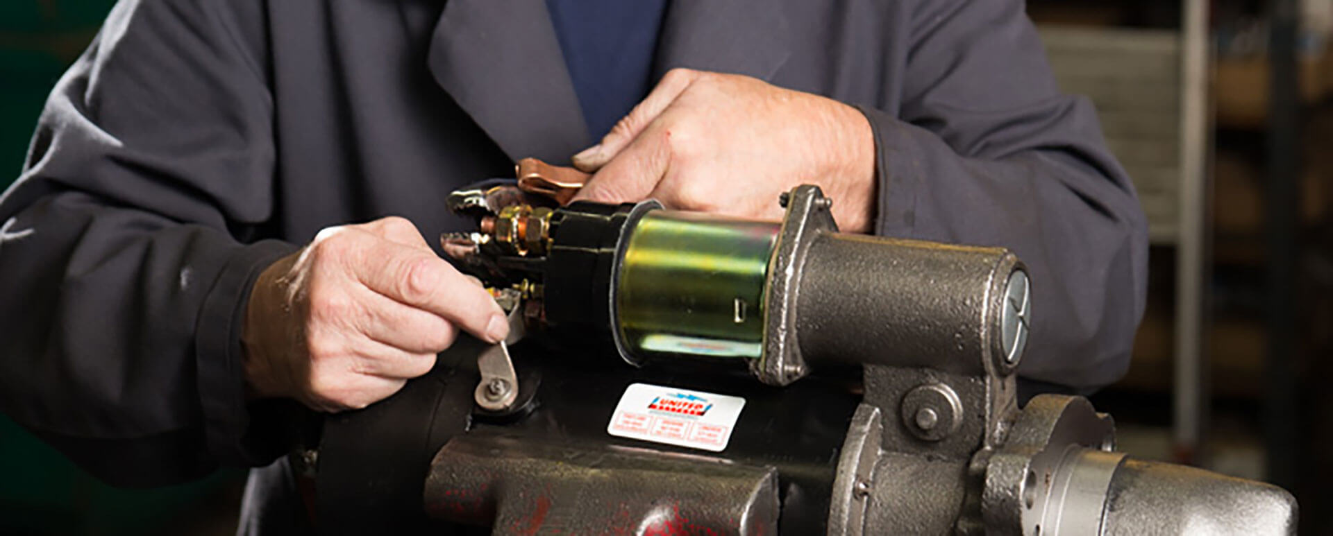 an image of a technician working on a custom alternator