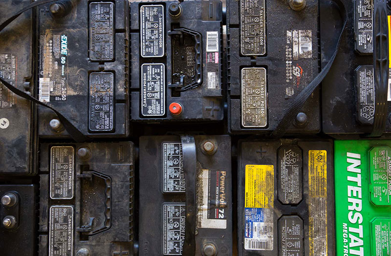 an image of rows of old, recycled batteries next to each other