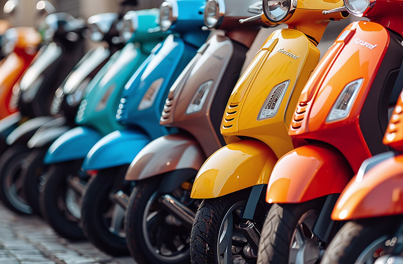 an image of a row of scooters in different colors