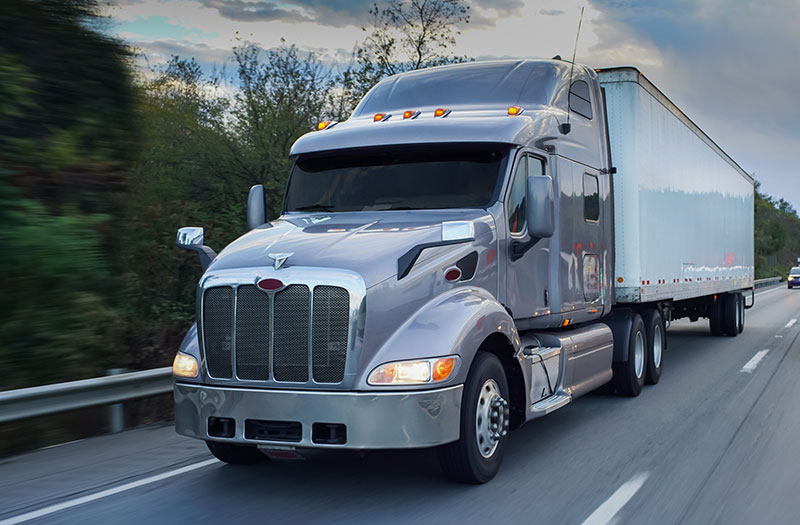 an image of a semi-trailer on the highway