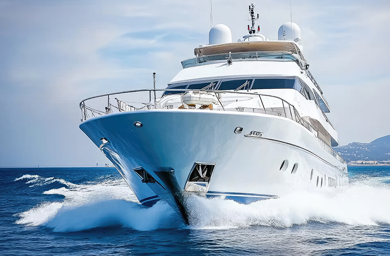A yacht cutting through waves.